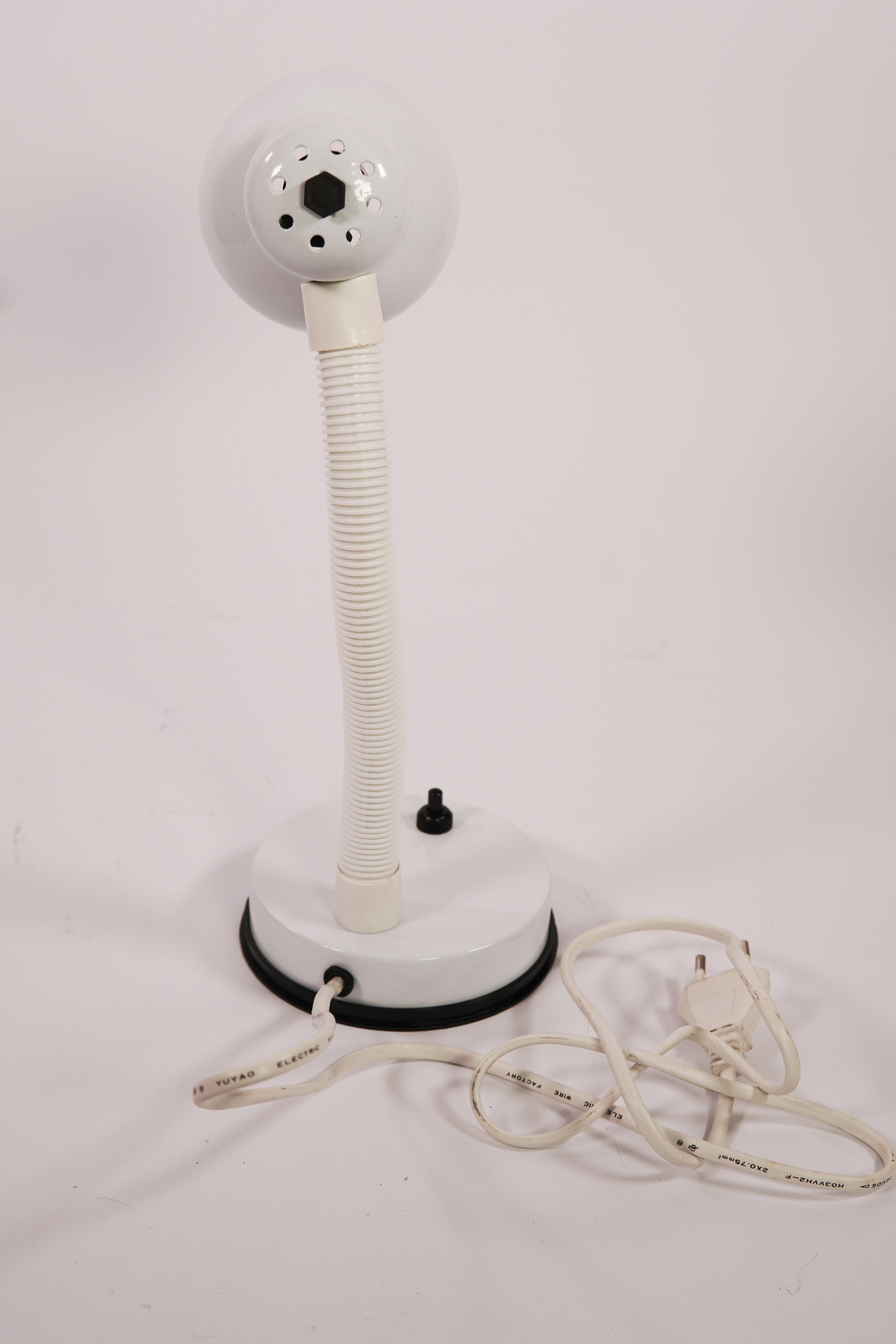 White adjustable lamp with flexible neck on a white background
