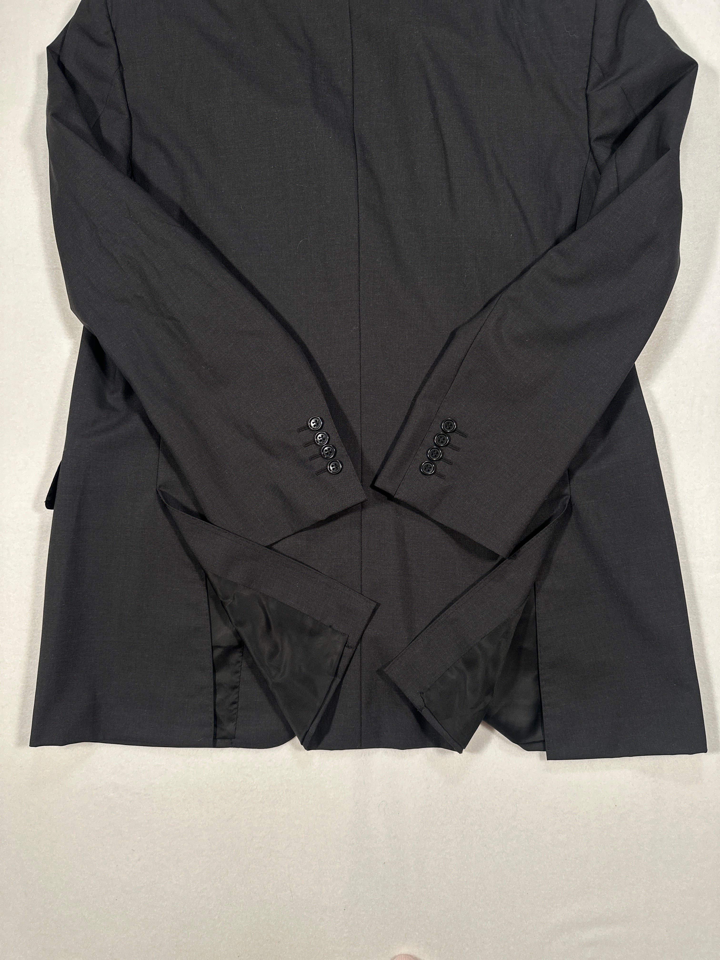 Black shirt with brand logo on a light gray background